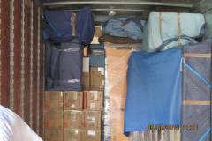 Neatly and securly stacked and packed in the trucks.